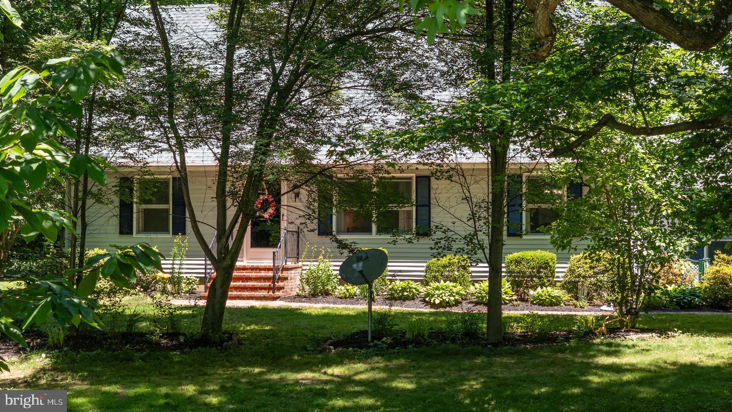 814 Wrights Neck Road Centreville, MD 21617 - Photo 6 of 53 a view of a house with backyard and a tree