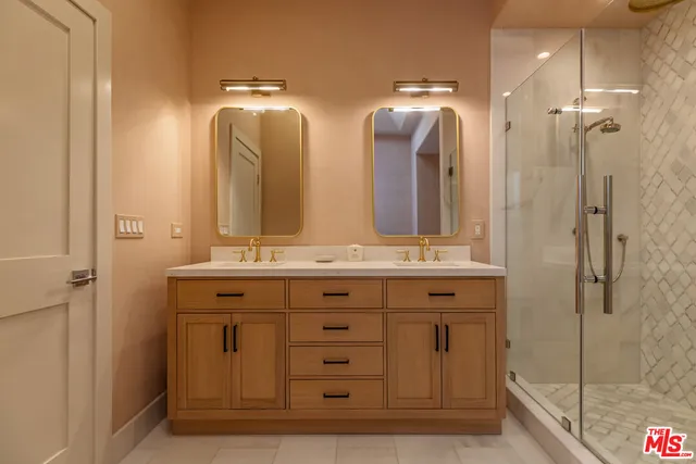 a bathroom with a double vanity sink mirror and double