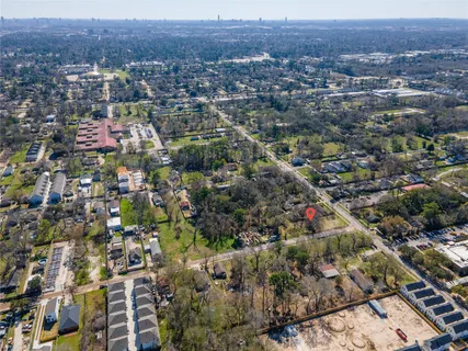 an aerial view of residential houses with city view