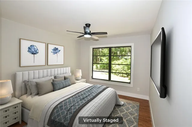 a bedroom with a large bed and a window