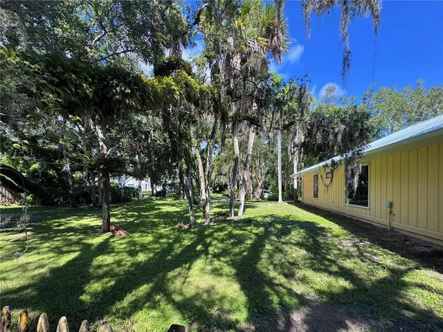 a backyard of a house with lots of green space