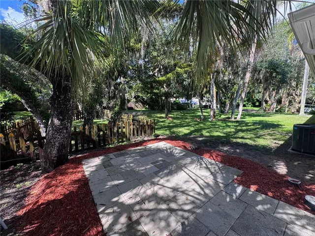 a view of a park with a tree