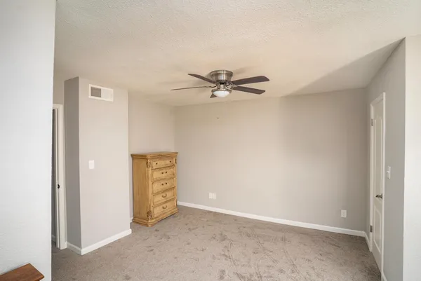 a view of a livingroom with a ceiling fan
