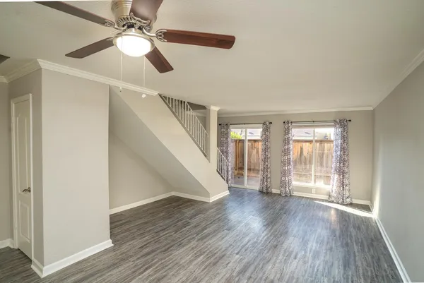 wooden floor in an empty room with a window