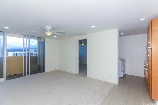 a view of an empty room with a bathroom