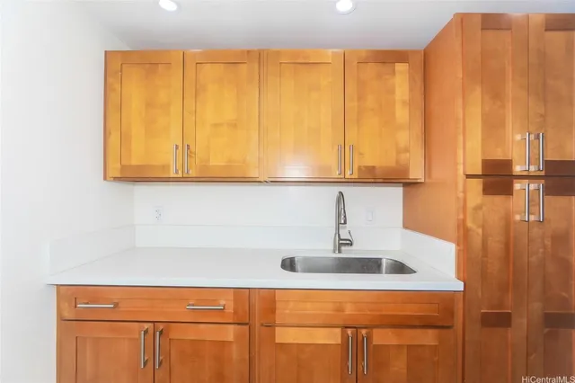 a bathroom with a sink a mirror and a window