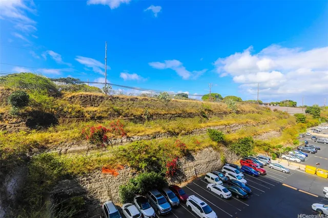 an empty room with a ceiling fan and a window