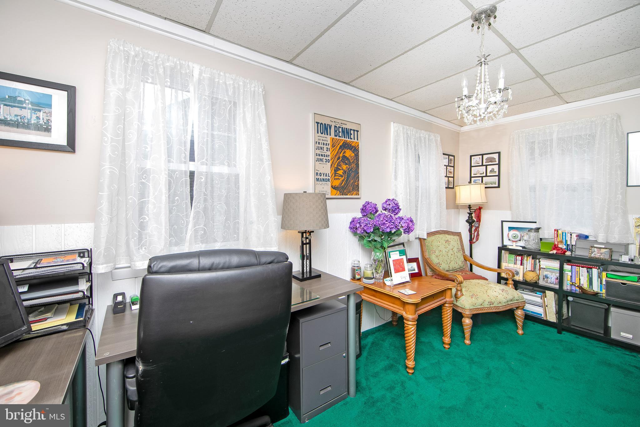 1002 Emerald Haddon Township, NJ 08108 - Photo 8 of 41 a living room with furniture and a chandelier