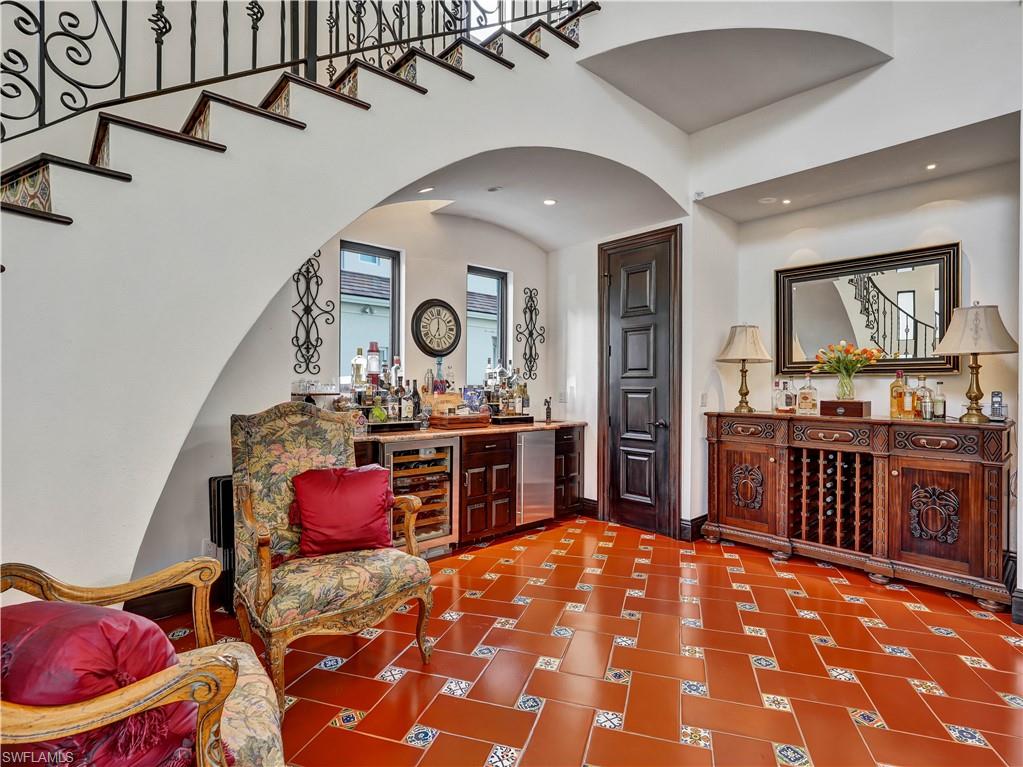 2535 Tarpon Road Naples, FL 34102 - Photo 6 of 50 Living area featuring high ceilings, a circular ceiling detail with a fan, and clerestory windows