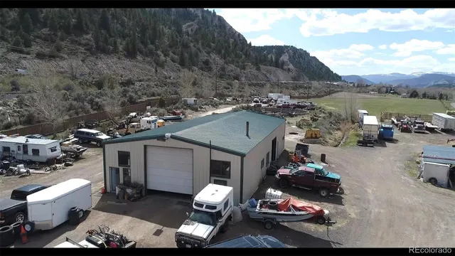 a view of outdoor space with garden and trees