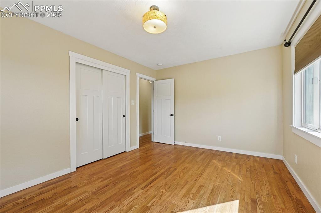 1305 Sunset Road Colorado Springs, CO 80909 - Photo 16 of 50 a view of an empty room with window and closet area