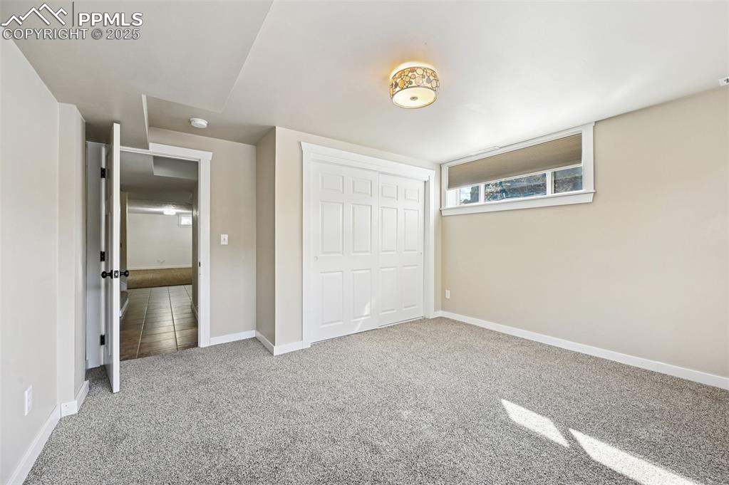 1305 Sunset Road Colorado Springs, CO 80909 - Photo 28 of 50 a view of an empty room and kitchen view