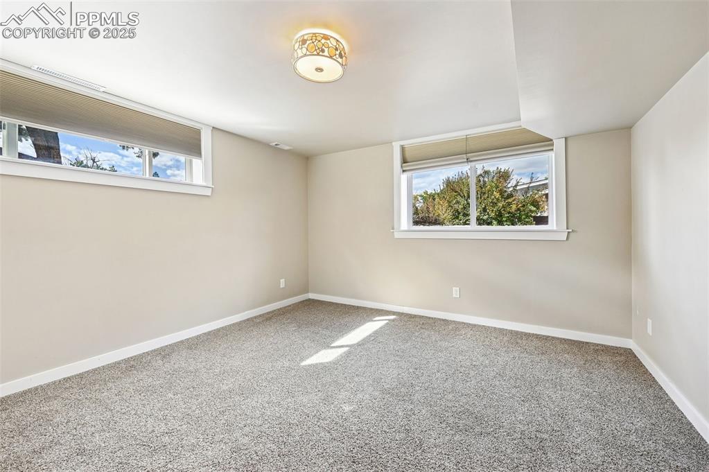1305 Sunset Road Colorado Springs, CO 80909 - Photo 29 of 50 an empty room with windows