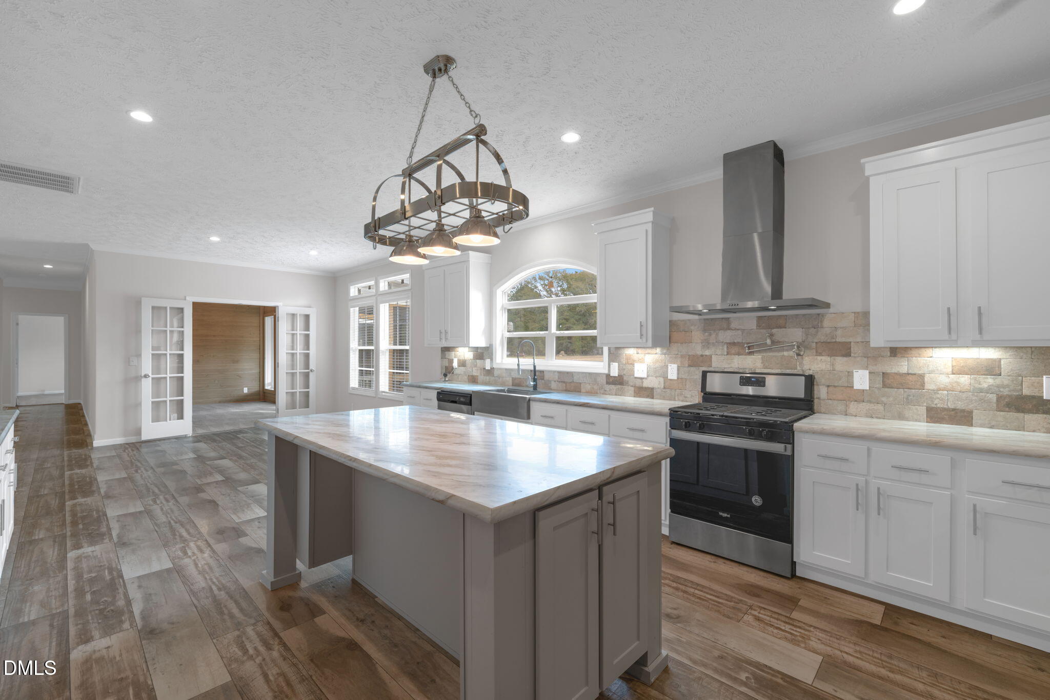 748 Gum Swamp Road Four Oaks, NC 27524 - Photo 10 of 43 a kitchen with stainless steel appliances granite countertop a sink and stove