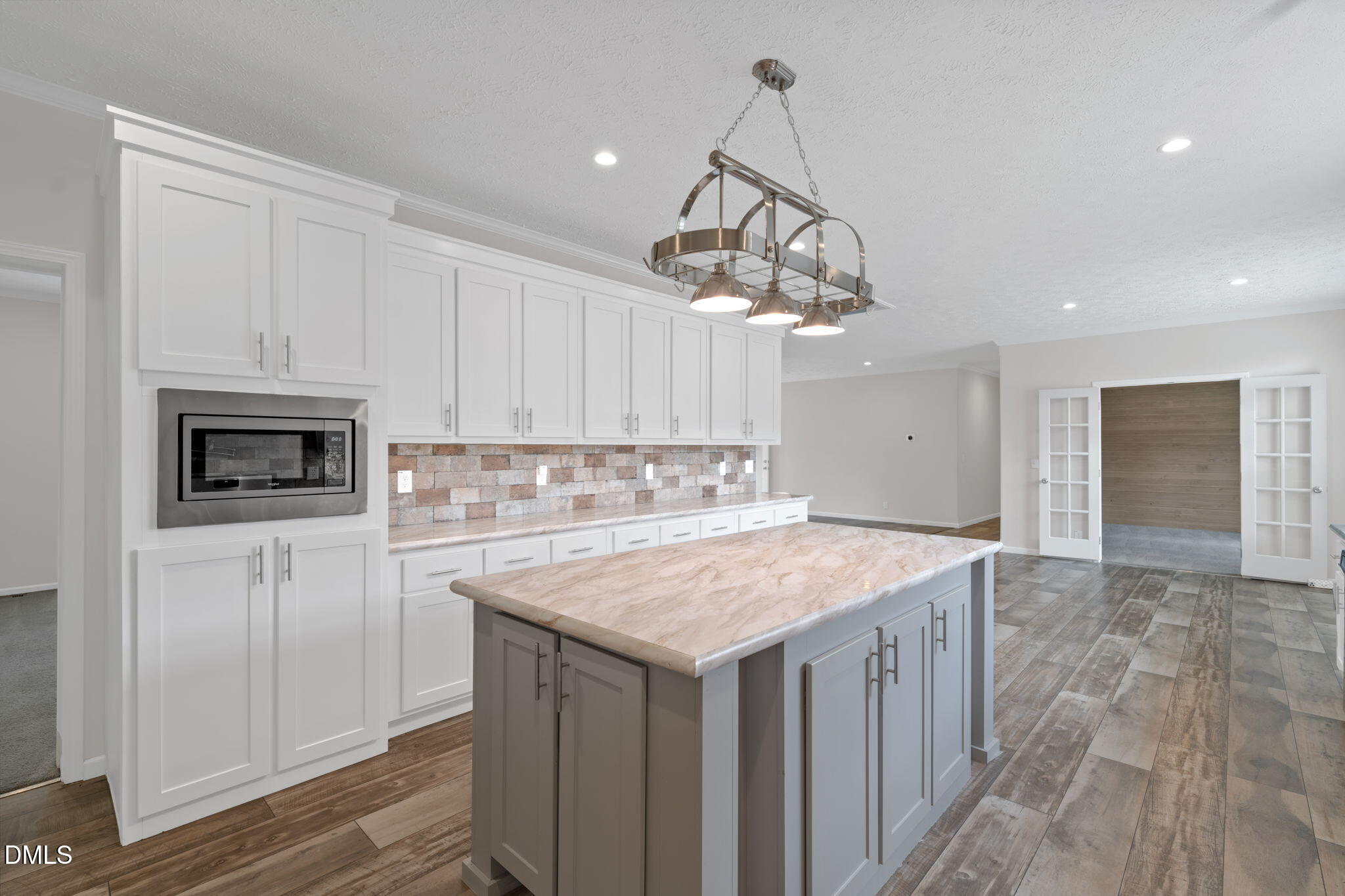 748 Gum Swamp Road Four Oaks, NC 27524 - Photo 11 of 43 a kitchen with a sink a microwave and cabinets