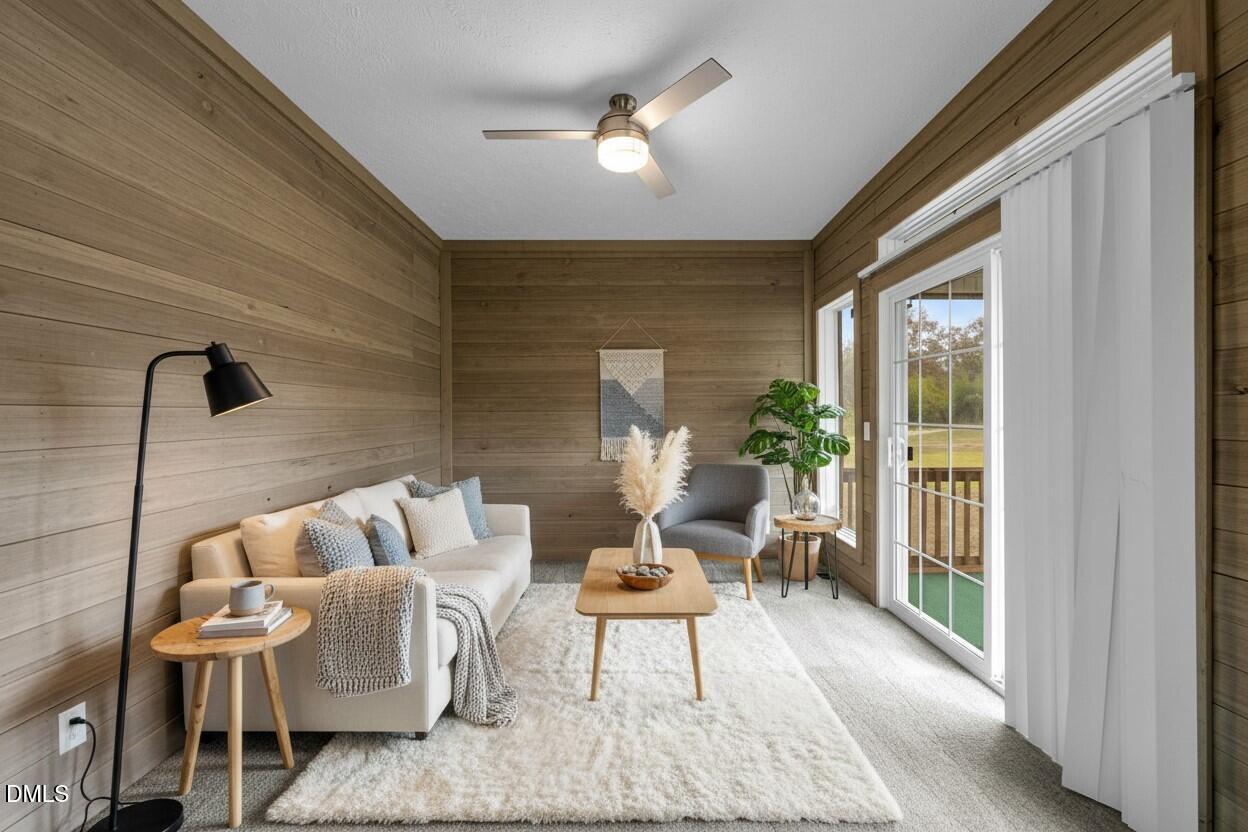 748 Gum Swamp Road Four Oaks, NC 27524 - Photo 12 of 43 a living room with furniture and a large window