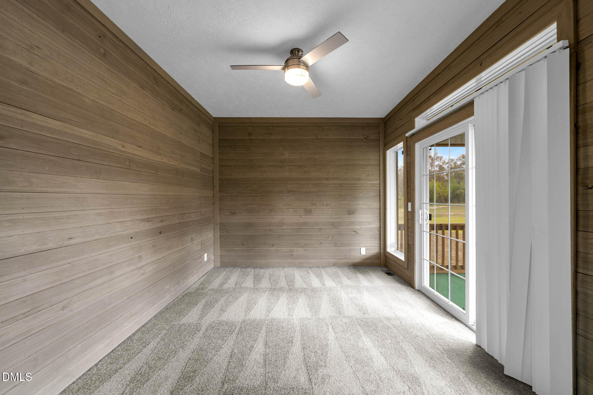 748 Gum Swamp Road Four Oaks, NC 27524 - Photo 13 of 43 a view of a room with wooden floor and white walls