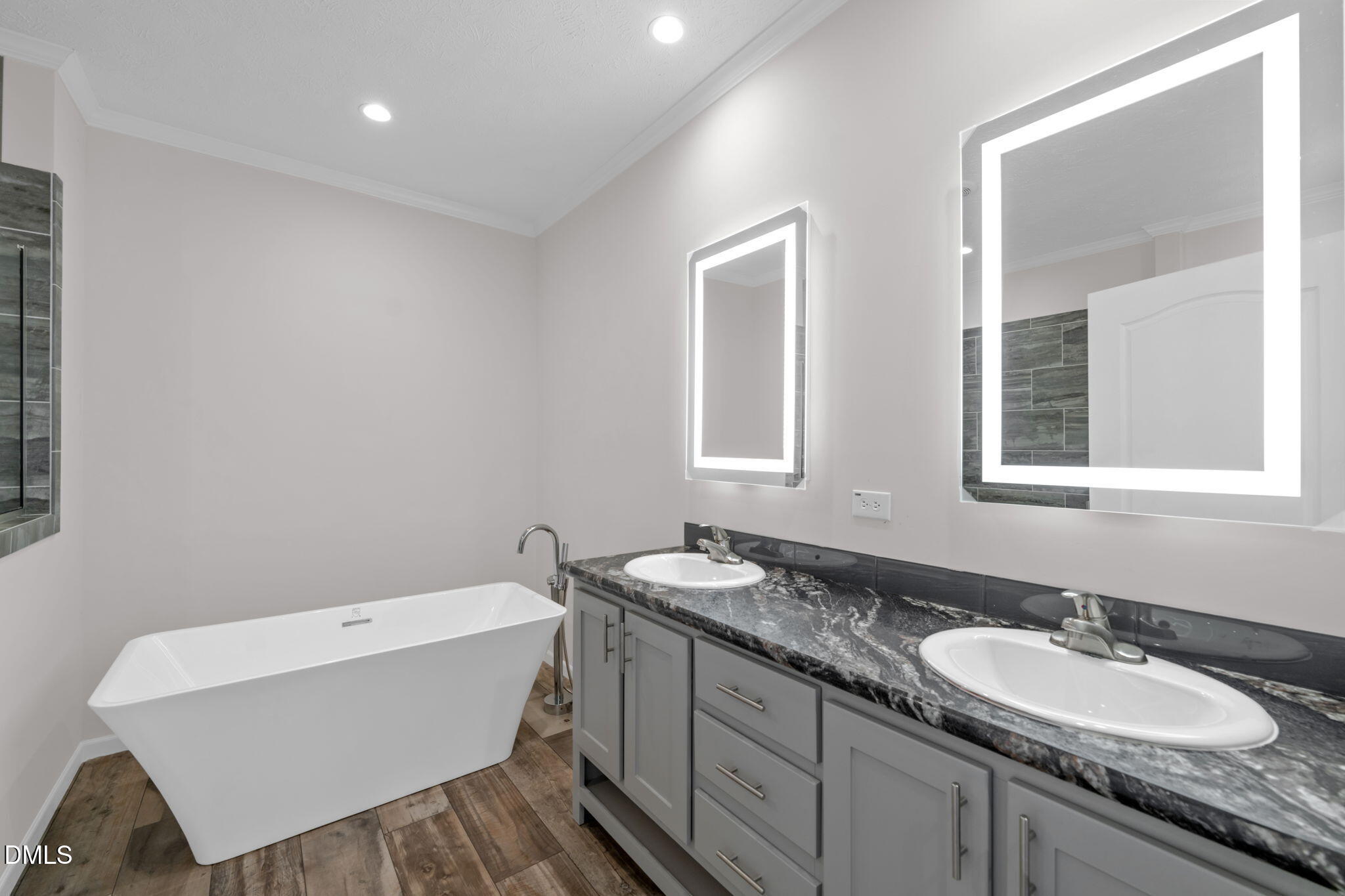 748 Gum Swamp Road Four Oaks, NC 27524 - Photo 19 of 43 a bathroom with a granite countertop sink mirror and a bathtub