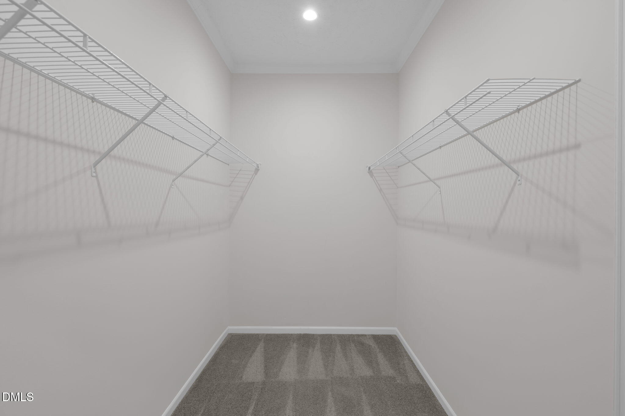 748 Gum Swamp Road Four Oaks, NC 27524 - Photo 21 of 43 a view of a room with racks on the wall