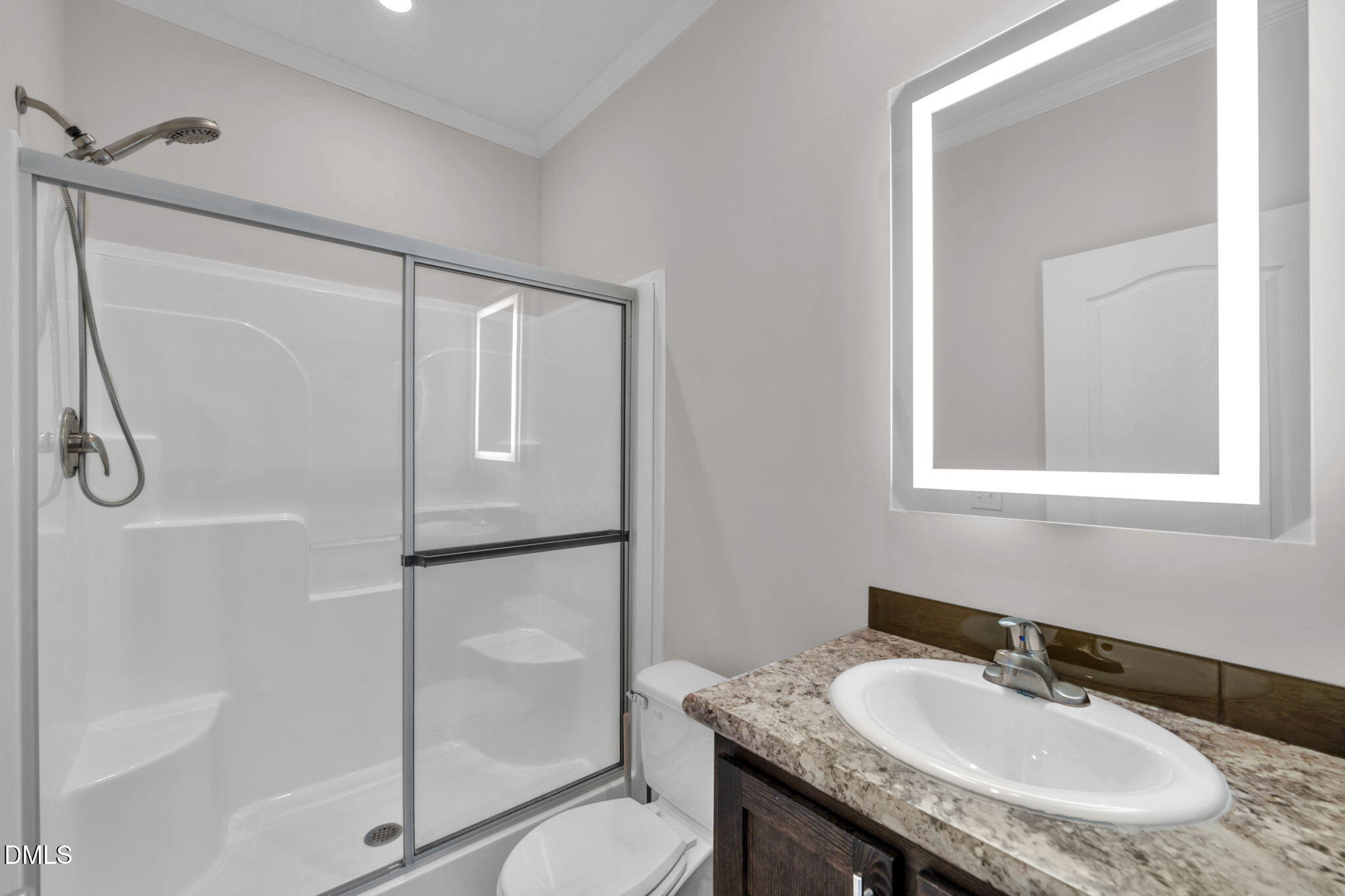 748 Gum Swamp Road Four Oaks, NC 27524 - Photo 25 of 43 a bathroom with a granite countertop sink toilet and shower