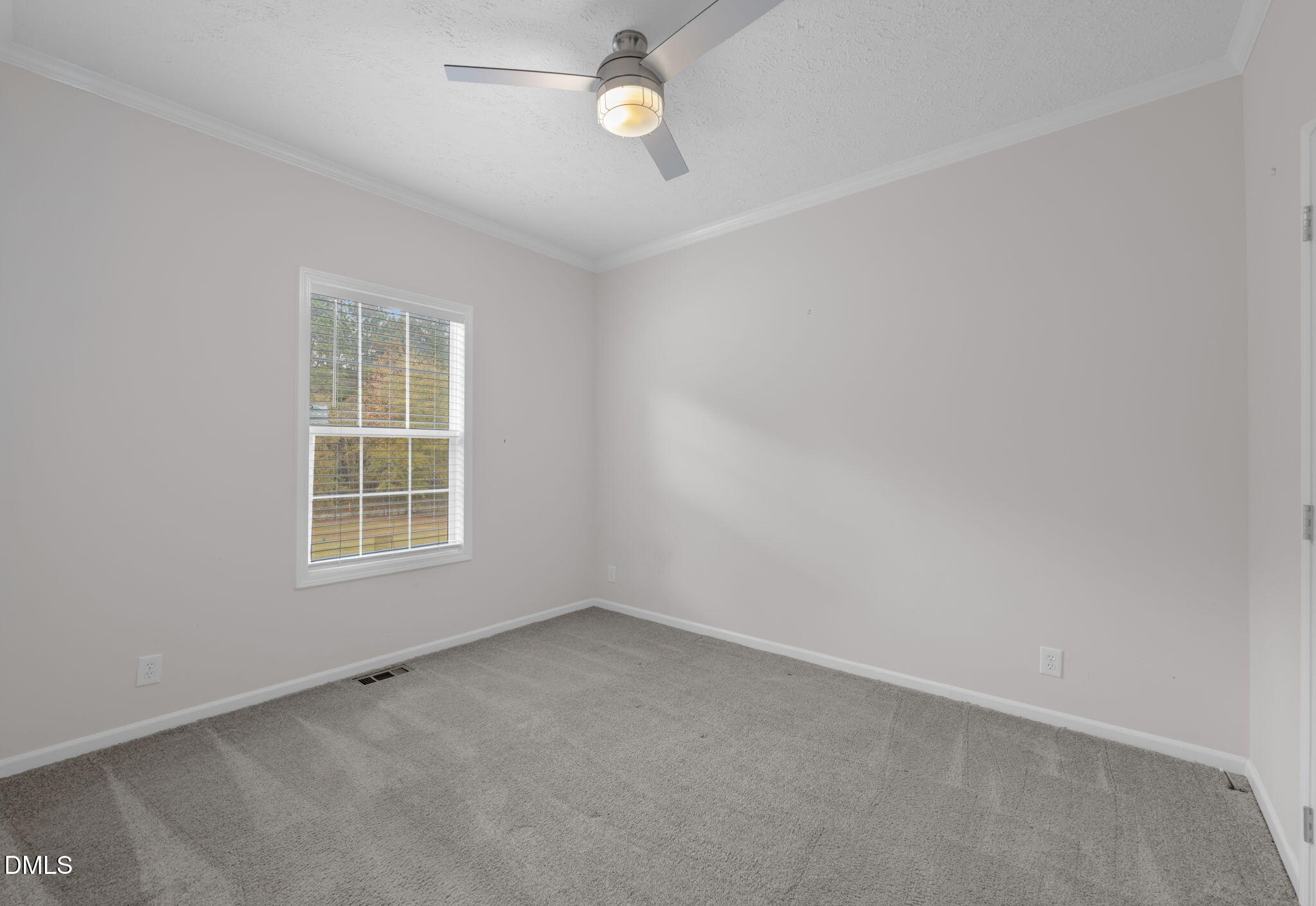 748 Gum Swamp Road Four Oaks, NC 27524 - Photo 27 of 43 an empty room with a window