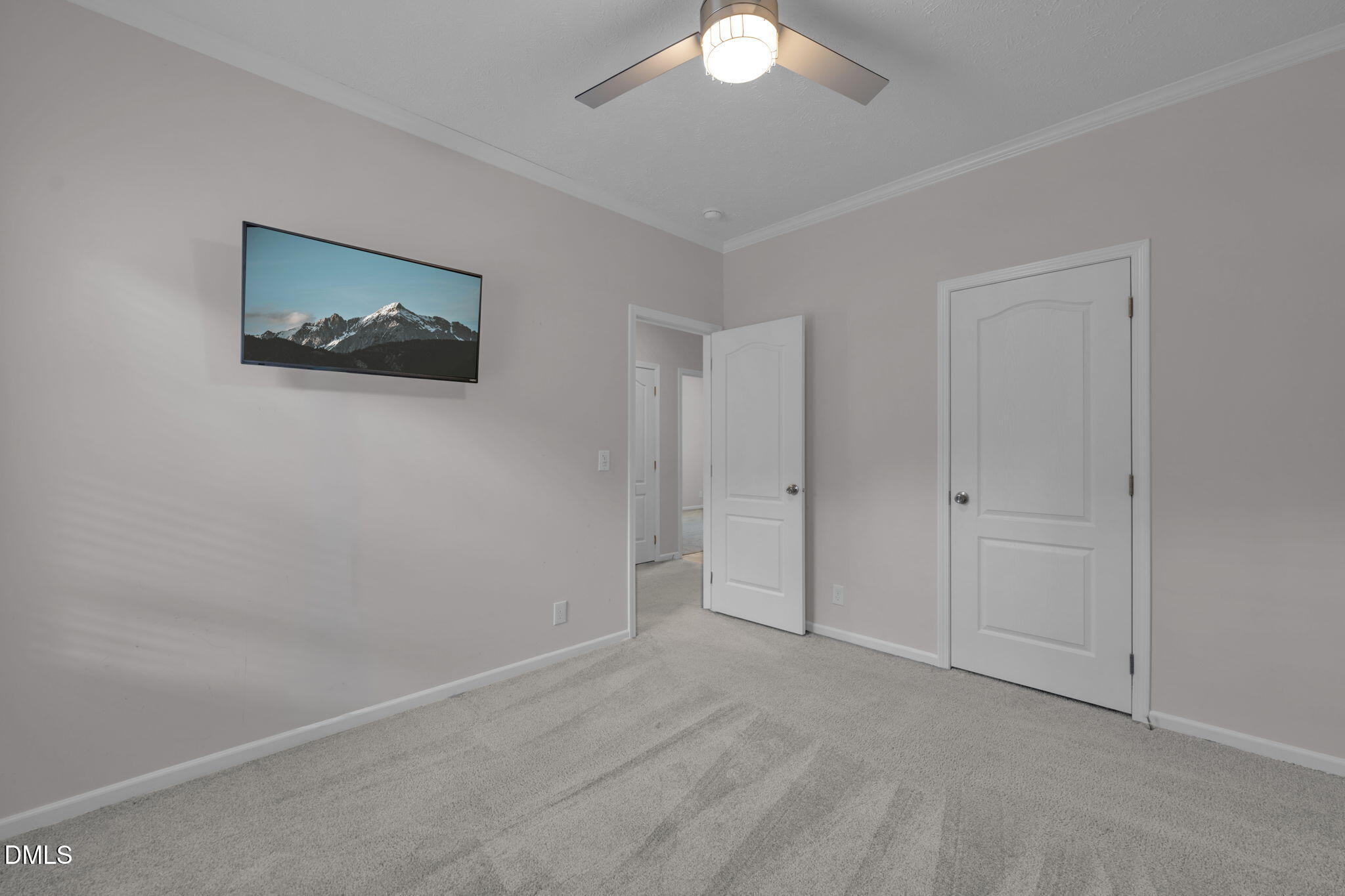 748 Gum Swamp Road Four Oaks, NC 27524 - Photo 28 of 43 a view of an empty room with a fan