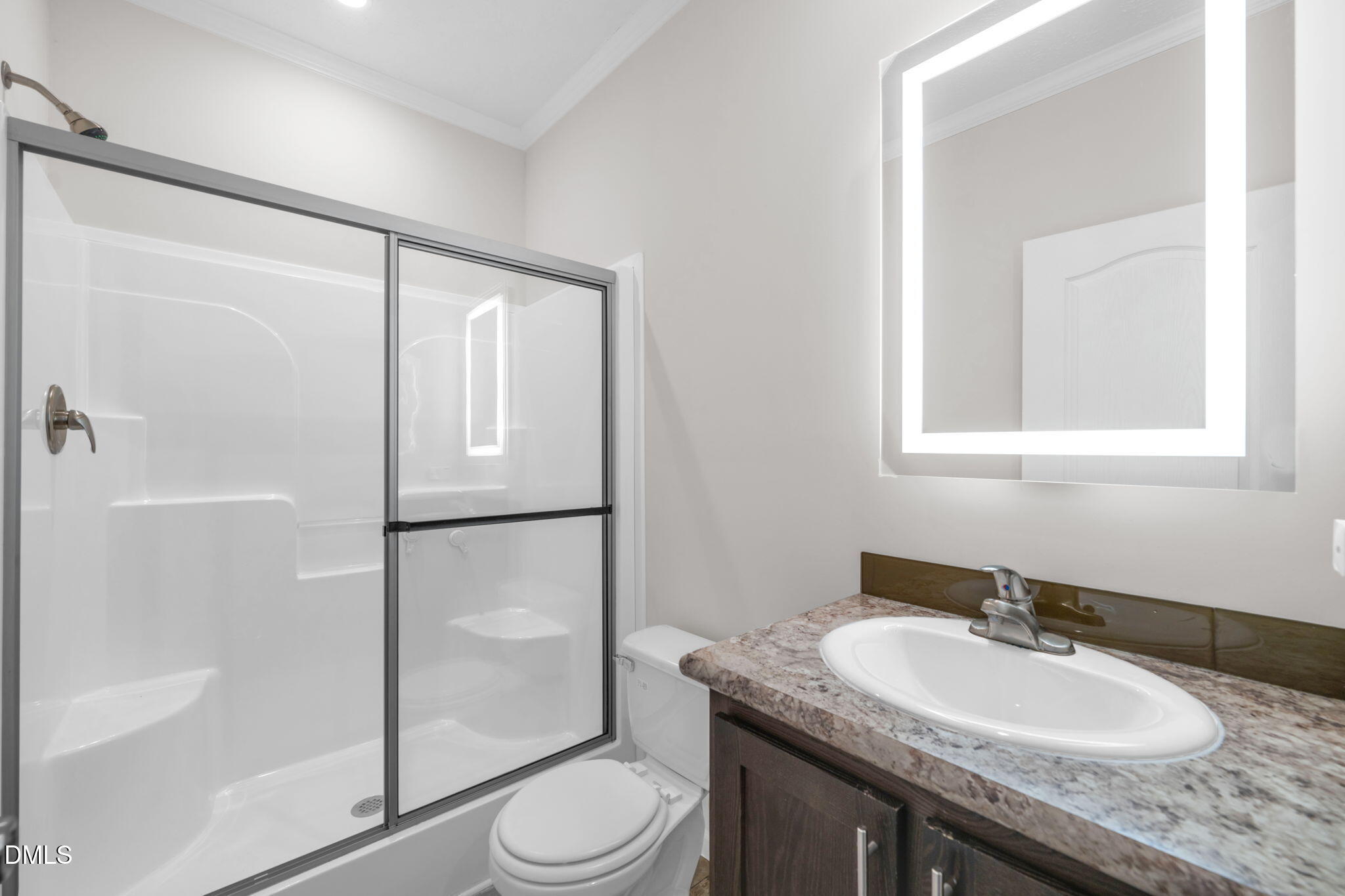 748 Gum Swamp Road Four Oaks, NC 27524 - Photo 30 of 43 a bathroom with a granite countertop sink toilet and shower