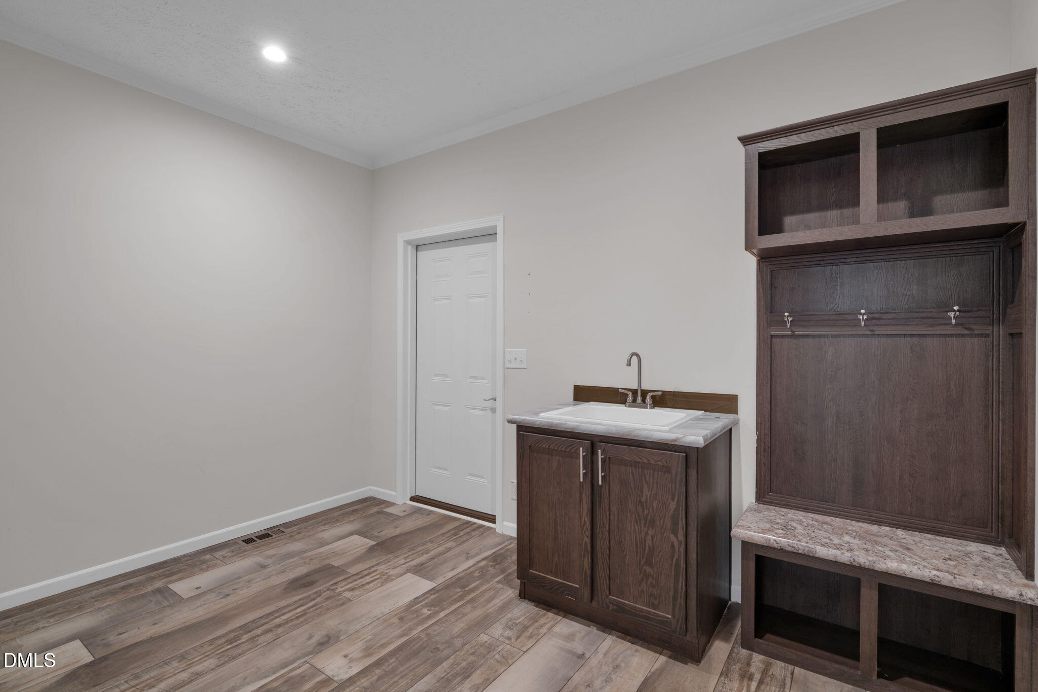 748 Gum Swamp Road Four Oaks, NC 27524 - Photo 32 of 43 a kitchen with a sink and cabinets