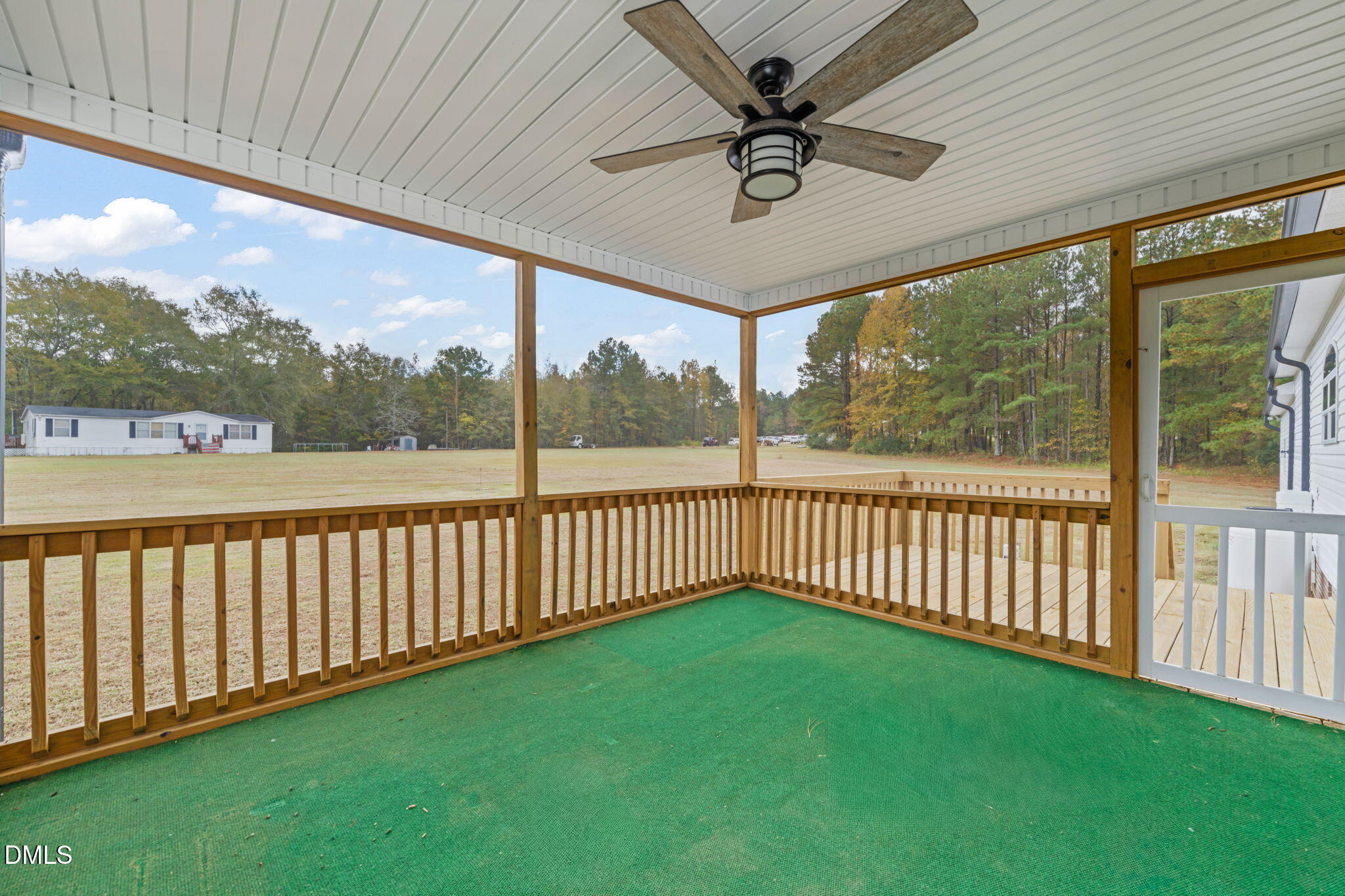 748 Gum Swamp Road Four Oaks, NC 27524 - Photo 36 of 43 a view of a porch with furniture and garden