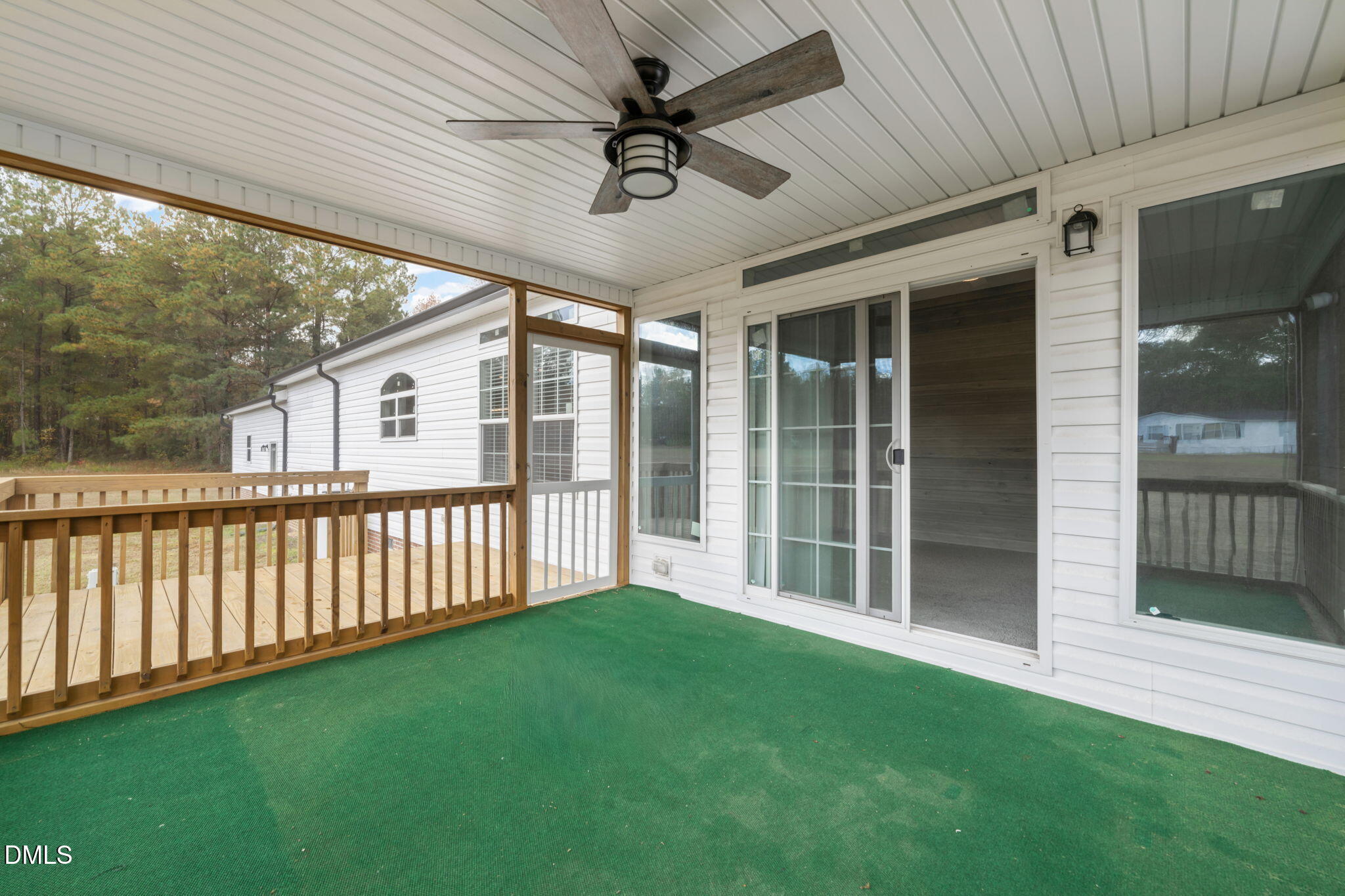 748 Gum Swamp Road Four Oaks, NC 27524 - Photo 37 of 43 a view of a porch with furniture and garden
