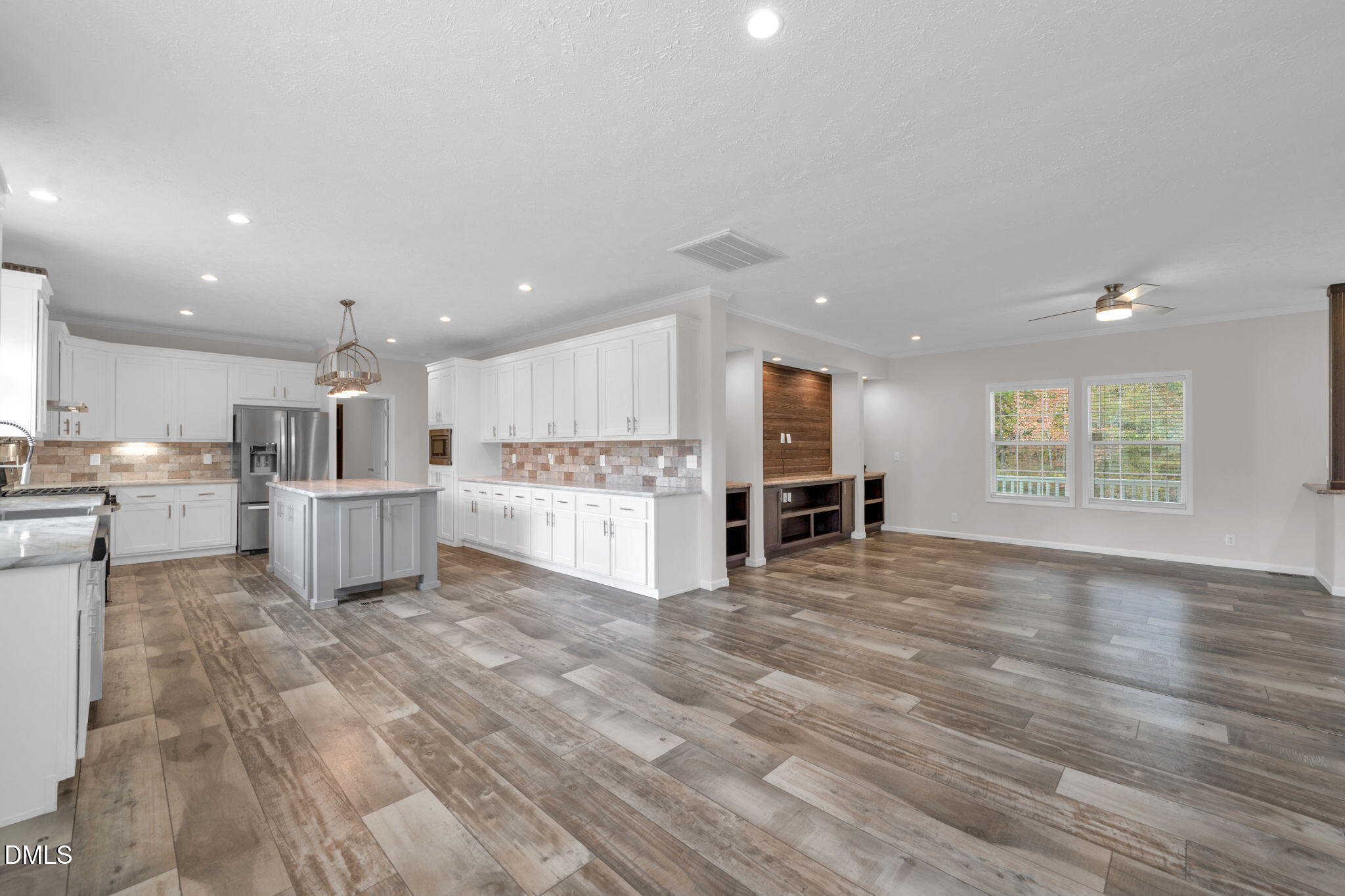 748 Gum Swamp Road Four Oaks, NC 27524 - Photo 43 of 43 a view of kitchen with wooden floor and windows