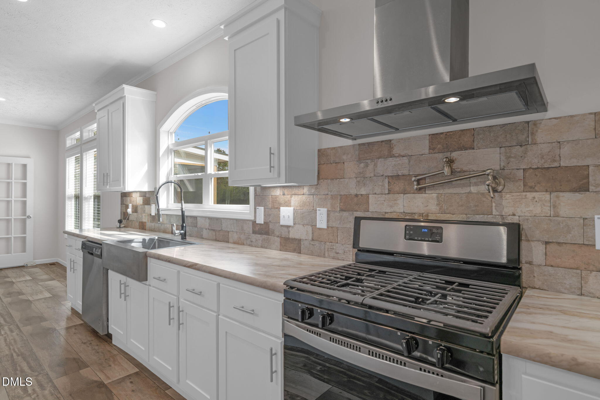 748 Gum Swamp Road Four Oaks, NC 27524 - Photo 9 of 43 a kitchen with granite countertop a stove and a sink