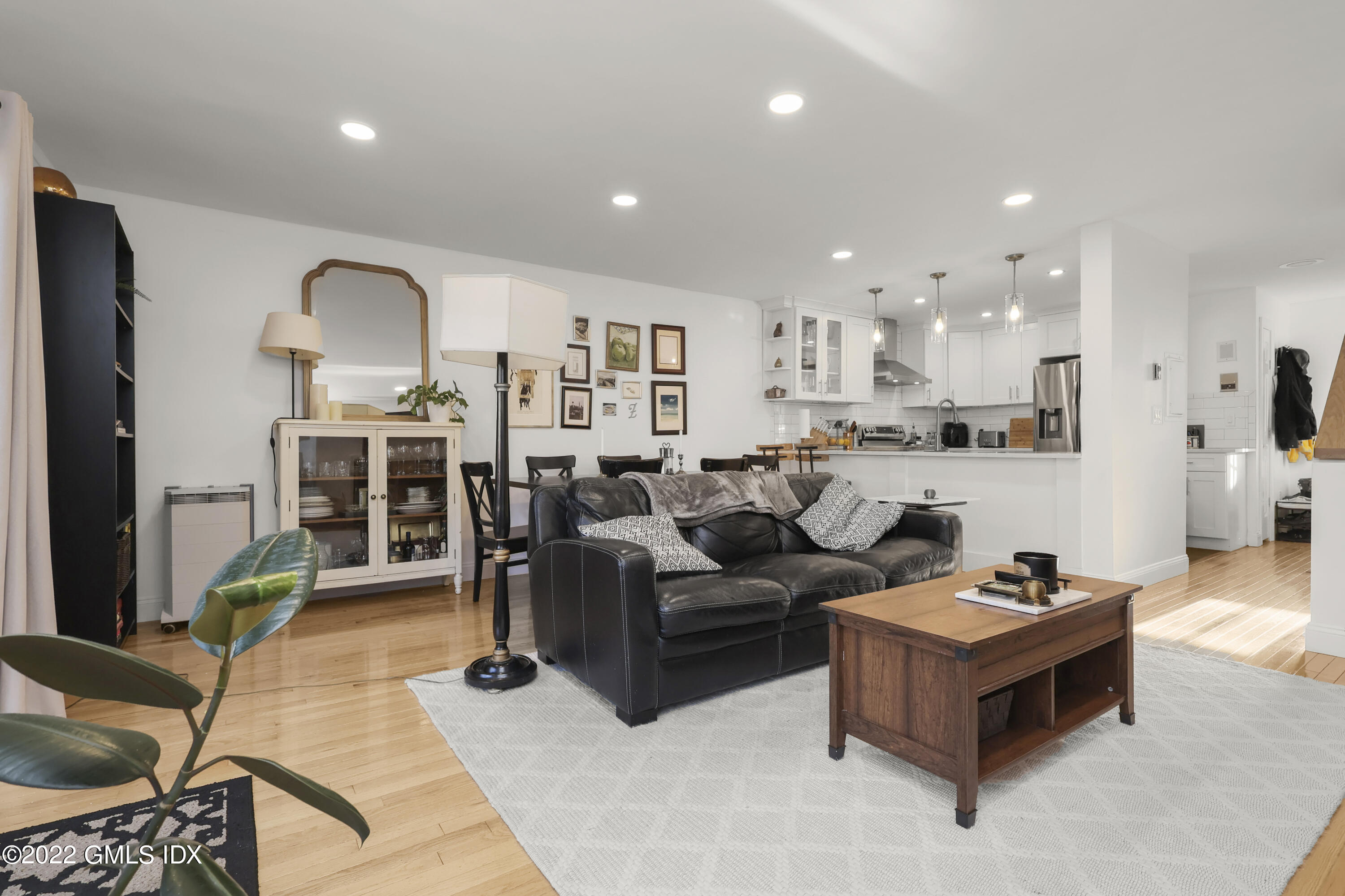 9 River Road, Unit 406 Cos Cob, CT 06807 - Photo 12 of 23 a living room with furniture and a wooden floor