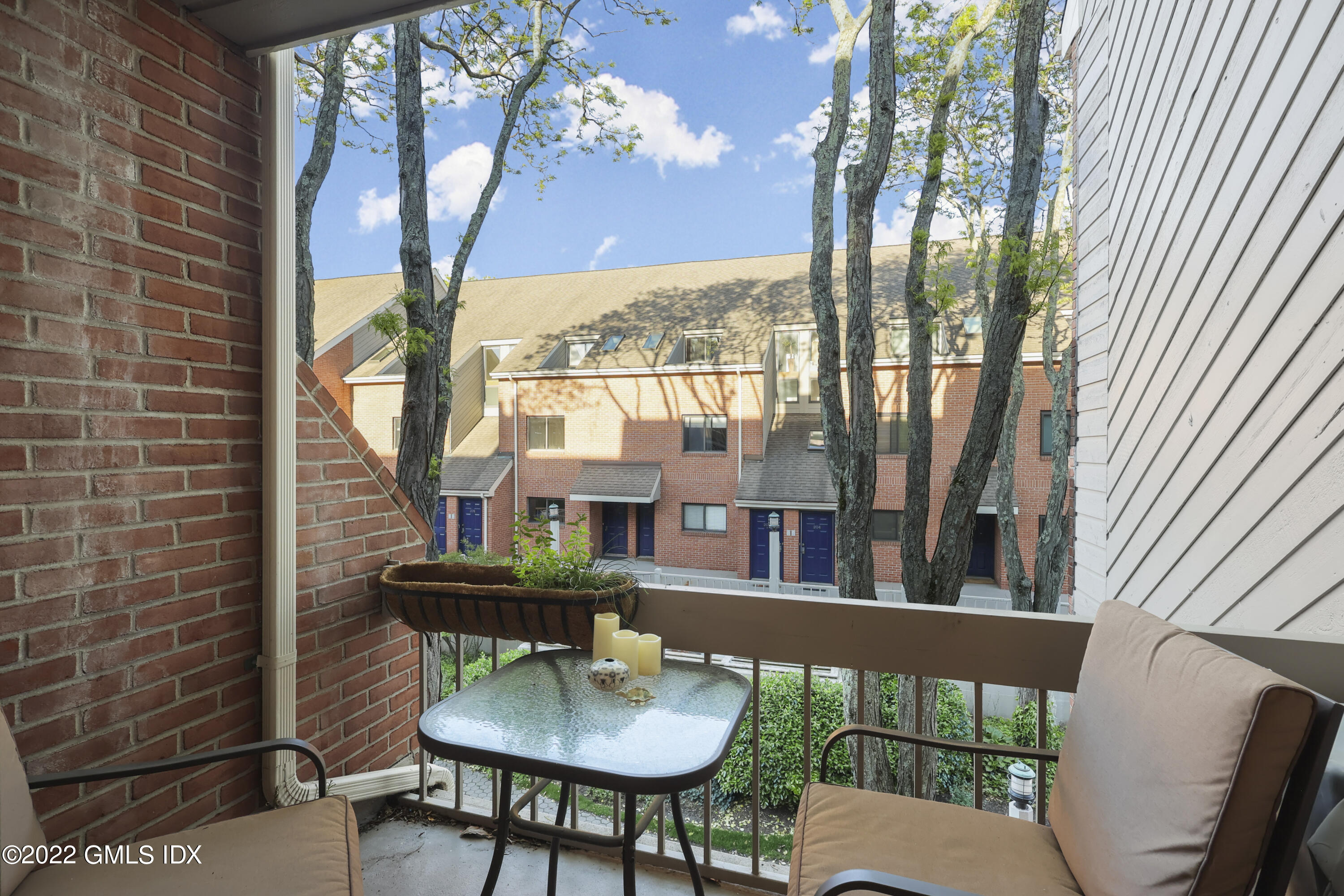 9 River Road, Unit 406 Cos Cob, CT 06807 - Photo 14 of 23 a view of a balcony dining area and kitchen view
