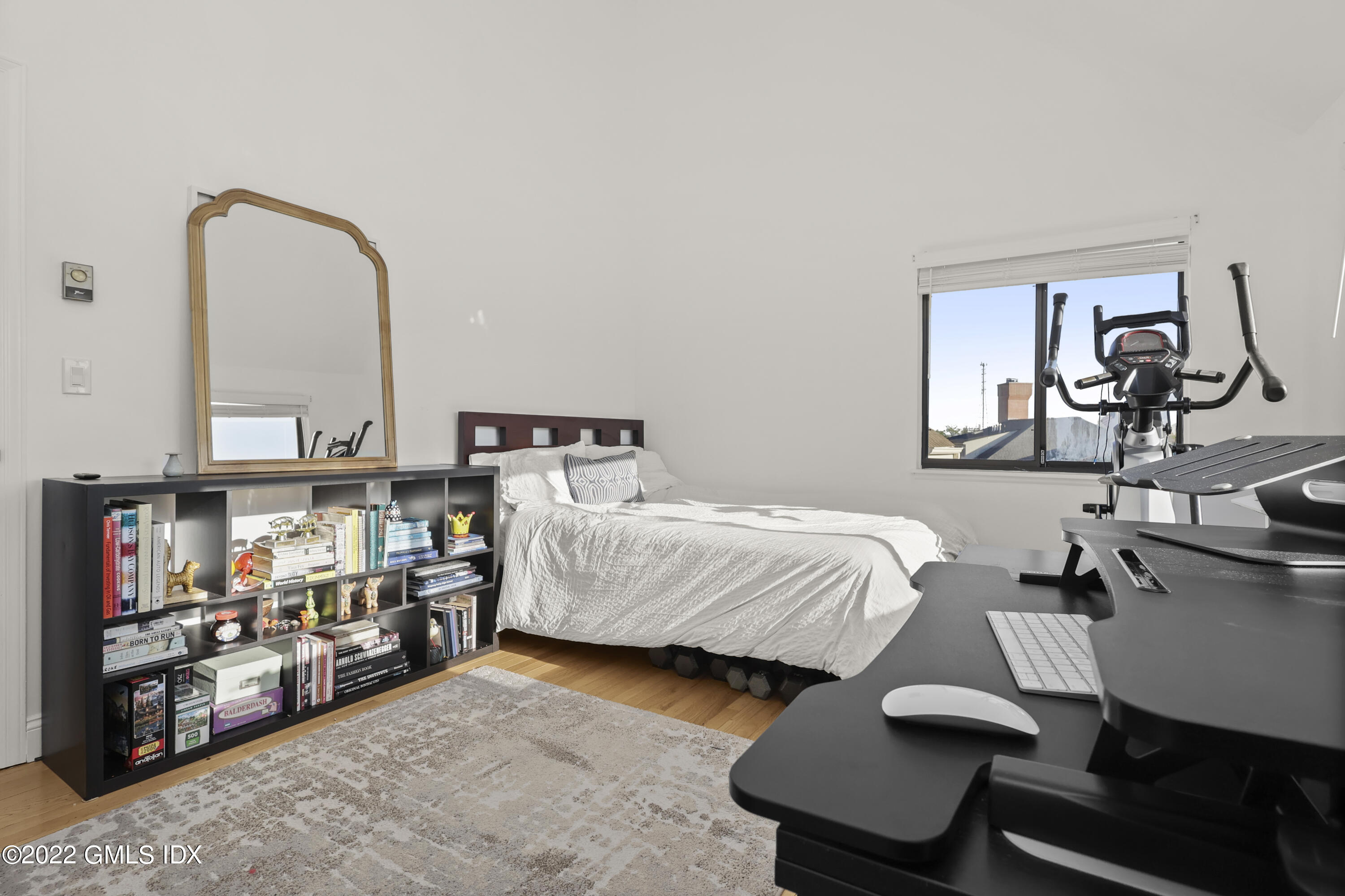 9 River Road, Unit 406 Cos Cob, CT 06807 - Photo 15 of 23 a bedroom with furniture and a mirror