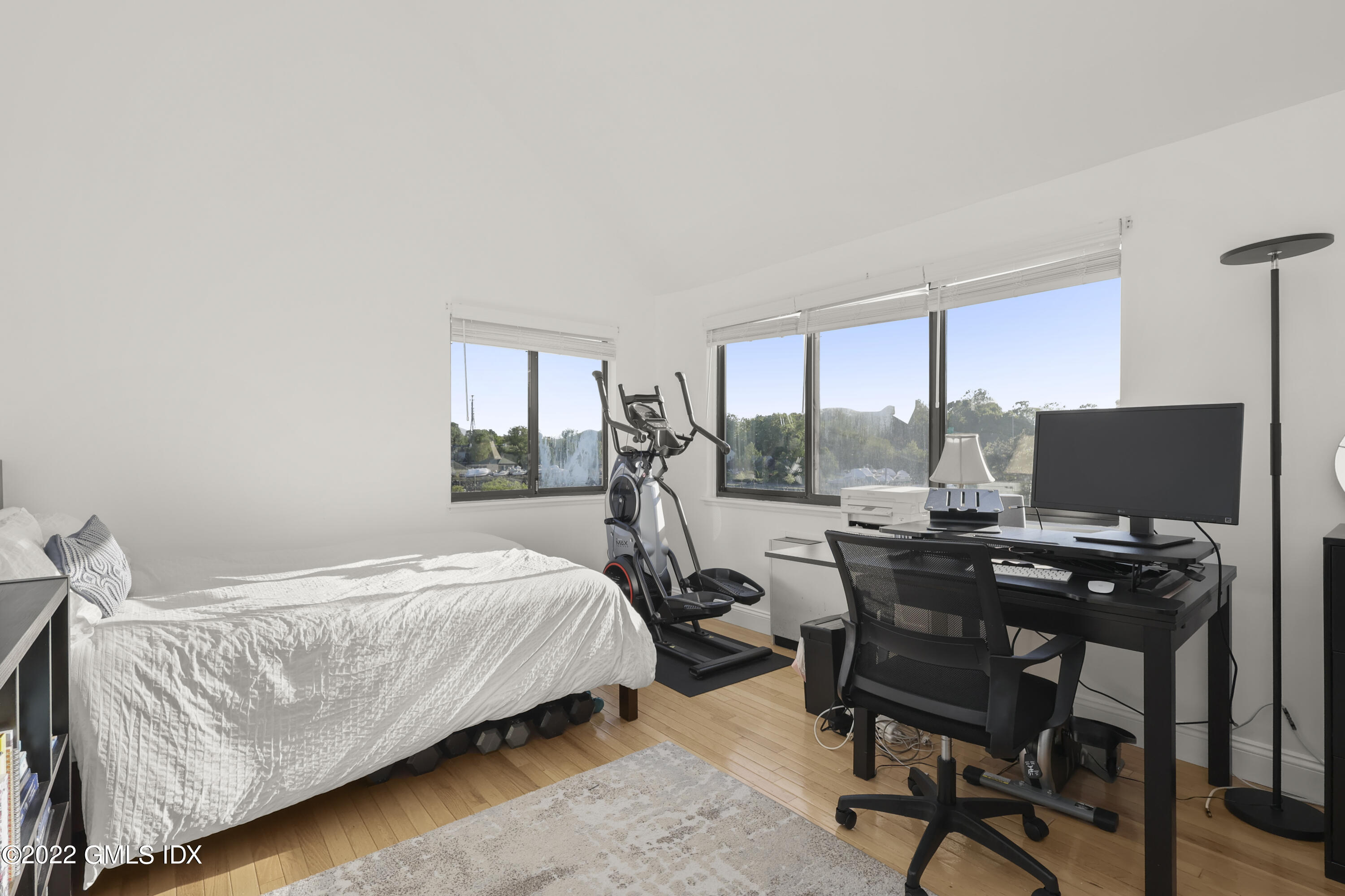 9 River Road, Unit 406 Cos Cob, CT 06807 - Photo 18 of 23 a bed room with a bed and a desk