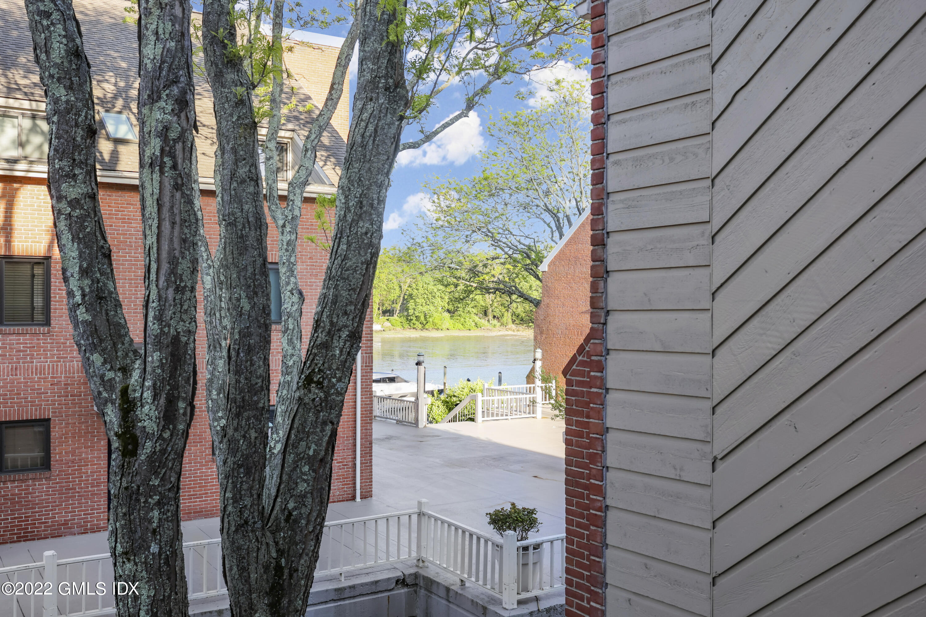 9 River Road, Unit 406 Cos Cob, CT 06807 - Photo 6 of 23 a view of yard from a balcony