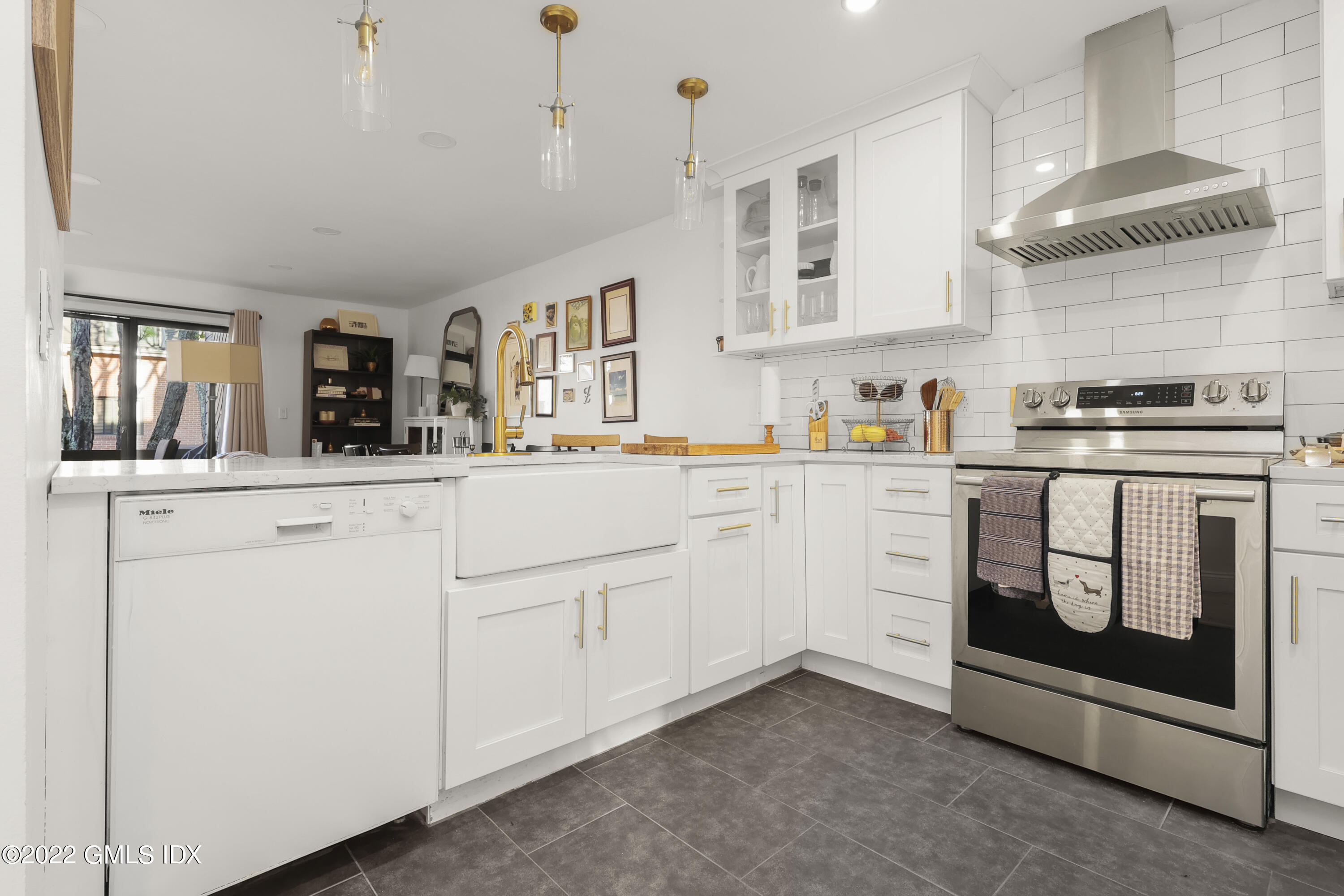 9 River Road, Unit 406 Cos Cob, CT 06807 - Photo 9 of 23 a kitchen with cabinets and window