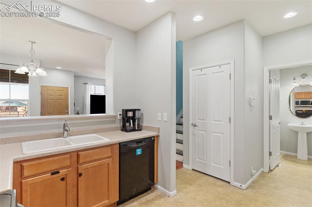 7644 Sandy Springs Point Fountain, CO 80817 - Photo 11 of 27 a bathroom with a sink and a mirror