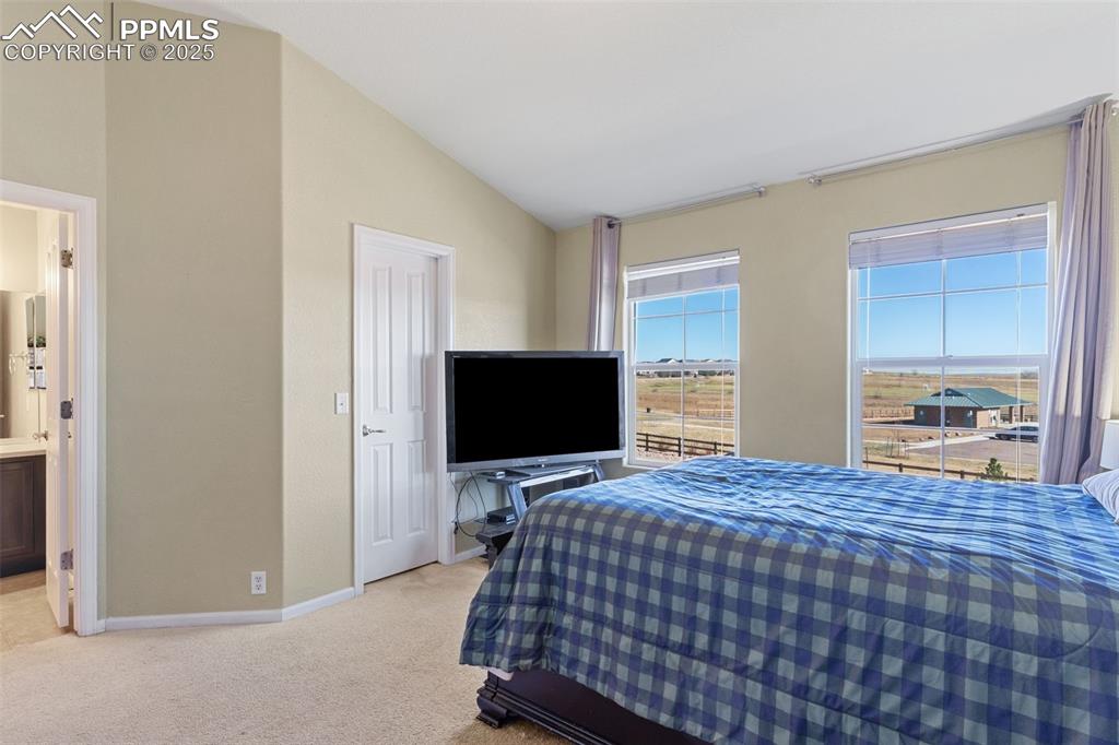 7644 Sandy Springs Point Fountain, CO 80817 - Photo 18 of 27 a bedroom with a bed and flat screen tv