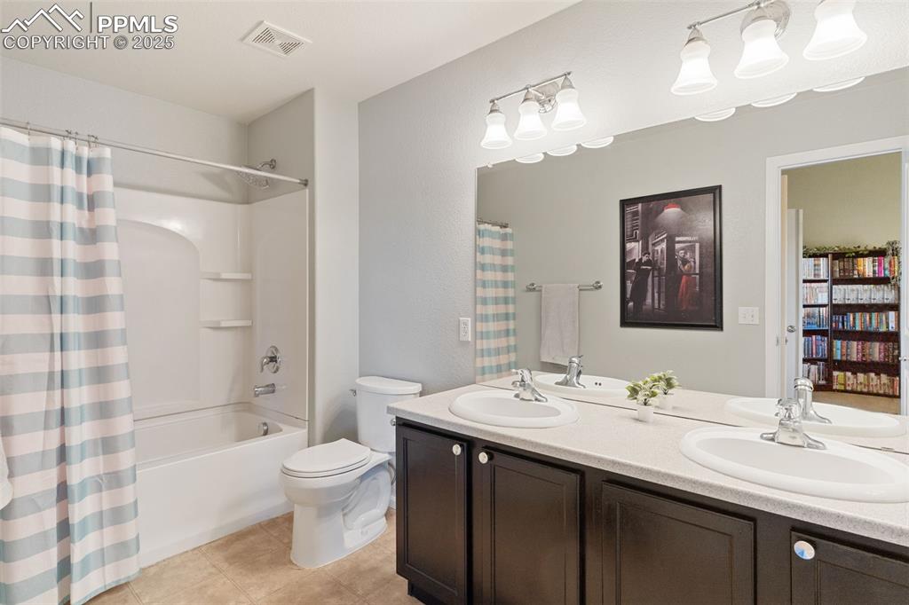 7644 Sandy Springs Point Fountain, CO 80817 - Photo 20 of 27 a bathroom with a sink a toilet and shower
