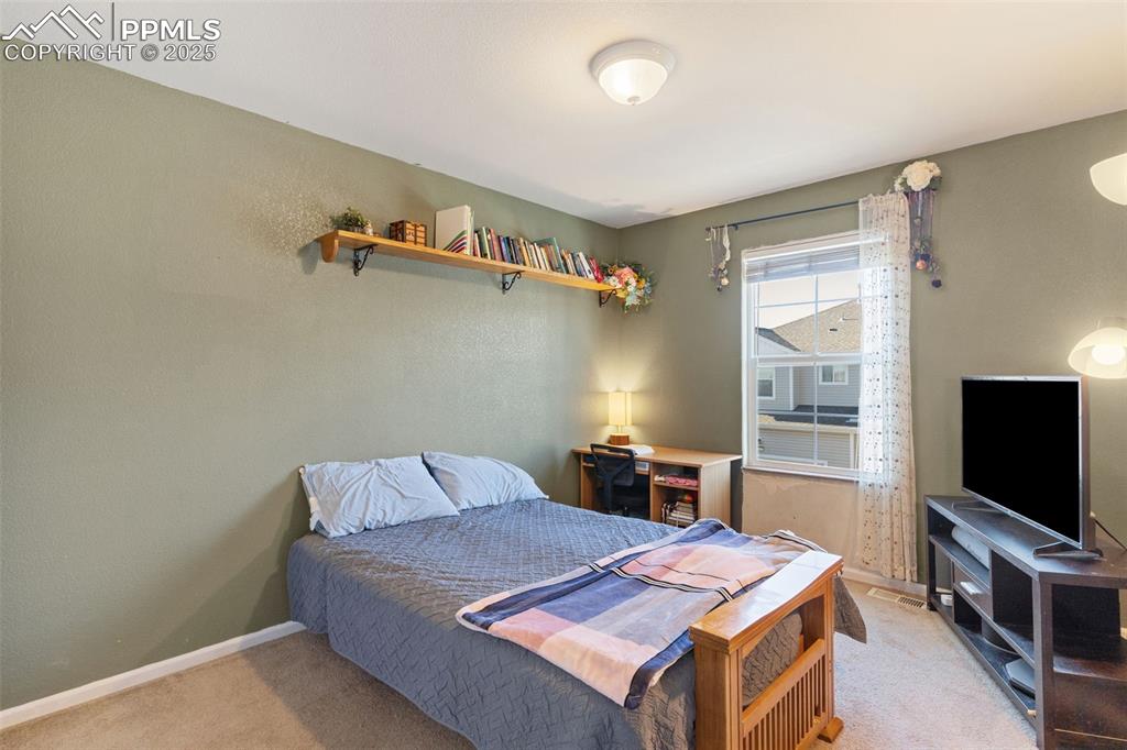 7644 Sandy Springs Point Fountain, CO 80817 - Photo 21 of 27 a living room with furniture and a flat screen tv