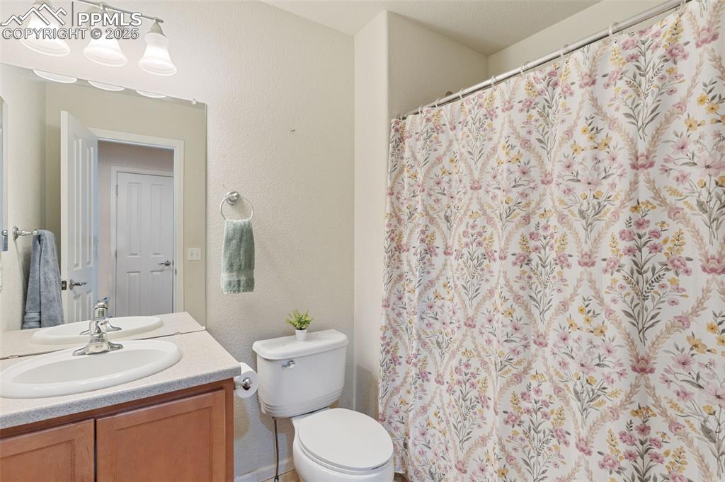 7644 Sandy Springs Point Fountain, CO 80817 - Photo 24 of 27 a bathroom with a sink and a toilet