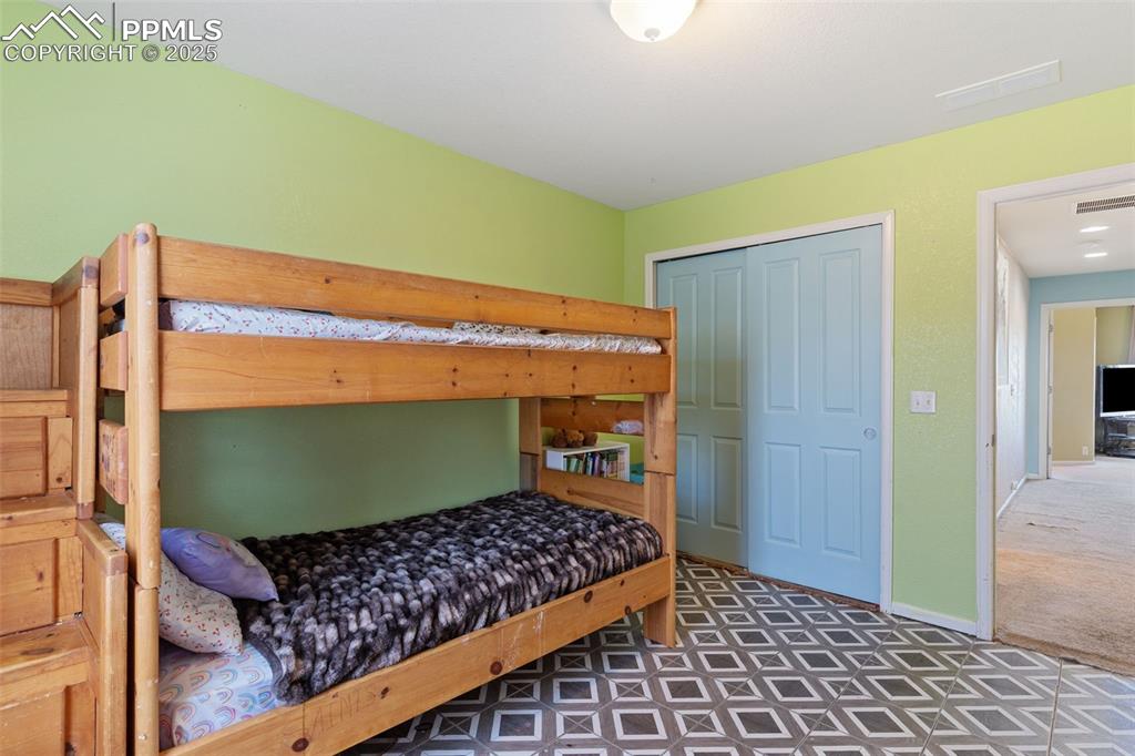 7644 Sandy Springs Point Fountain, CO 80817 - Photo 26 of 27 a room with wooden floor and furniture
