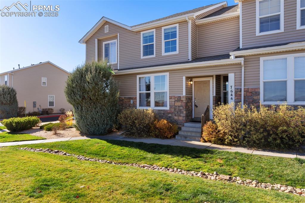 7644 Sandy Springs Point Fountain, CO 80817 - Photo 3 of 27 a front view of house with yard and green space