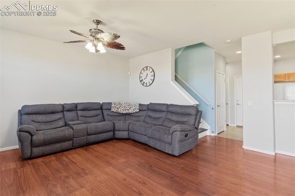 7644 Sandy Springs Point Fountain, CO 80817 - Photo 5 of 27 a living room with furniture and a wooden floor