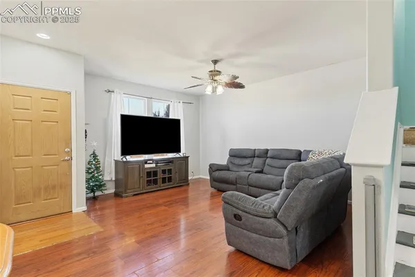 a living room with furniture and a flat screen tv