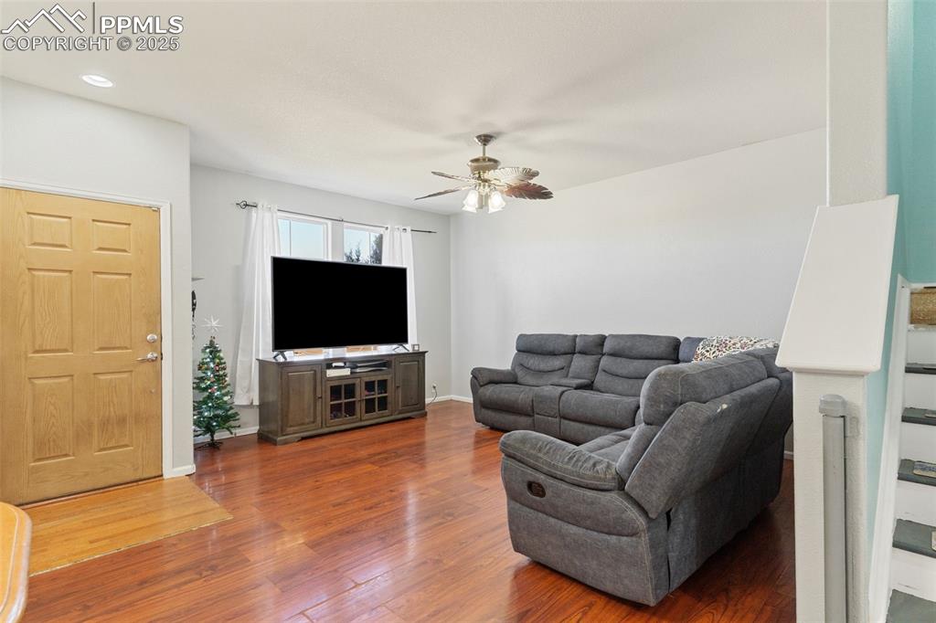 7644 Sandy Springs Point Fountain, CO 80817 - Photo 6 of 27 a living room with furniture and a flat screen tv