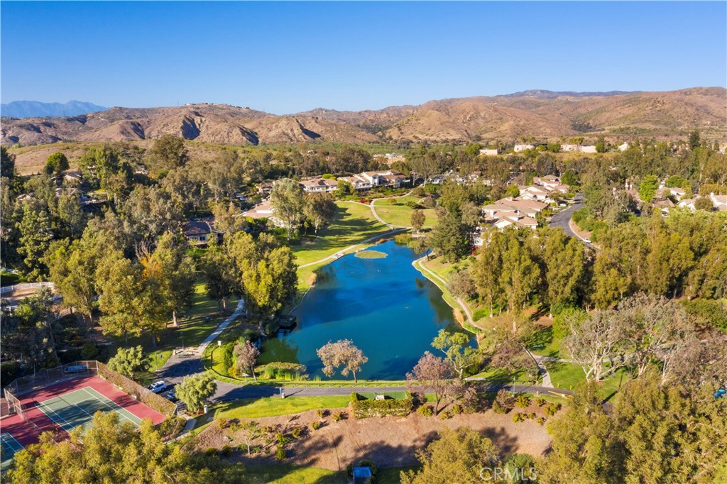 654 North Buttonbush Trail Orange, CA 92869 - Photo 2 of 23 a view of a houses with a mountain
