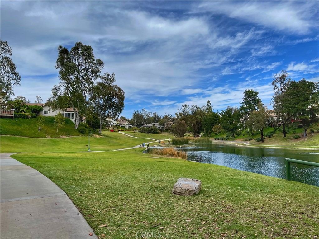 654 North Buttonbush Trail Orange, CA 92869 - Photo 21 of 23 a lake with trees in the background